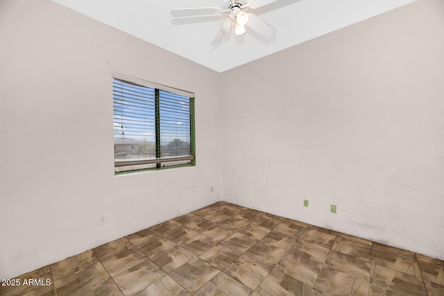 spare room with a ceiling fan