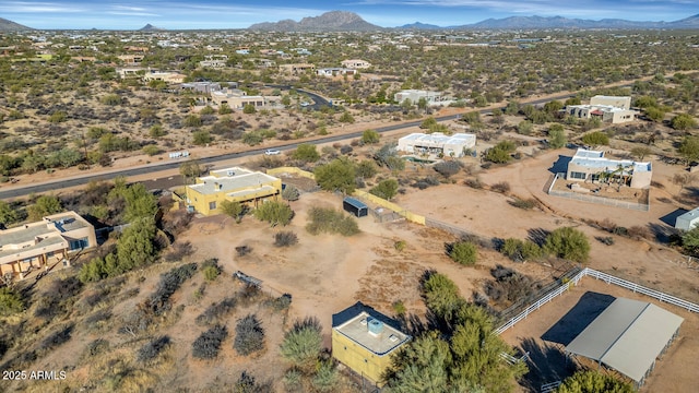 aerial view featuring a mountain view and a desert view