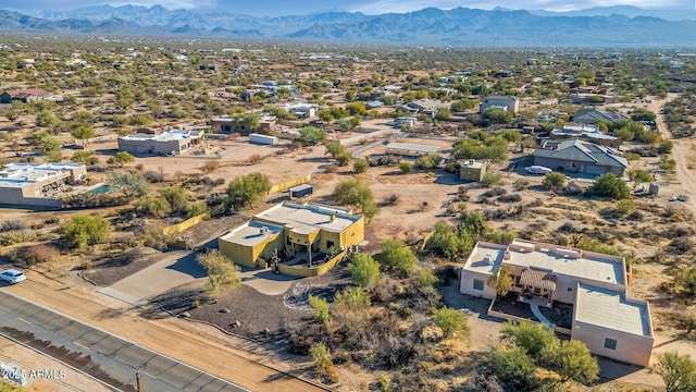 birds eye view of property featuring a mountain view