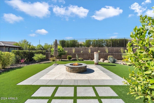 view of patio / terrace with a fire pit