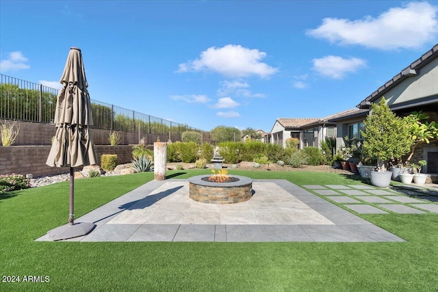 view of patio with an outdoor fire pit