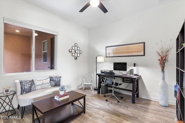 home office featuring ceiling fan, baseboards, and wood finished floors