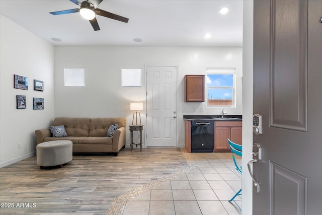 living room featuring recessed lighting, light tile patterned flooring, a ceiling fan, and a healthy amount of sunlight