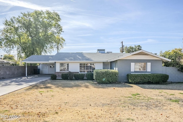 single story home featuring a carport