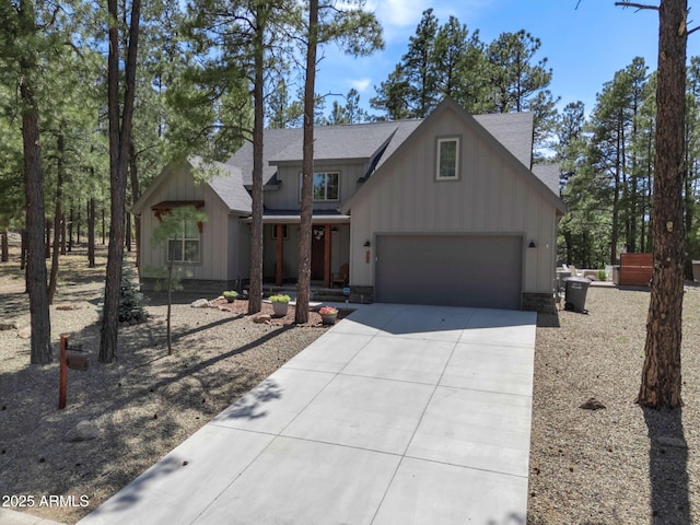 956 S Torrey Pines Dr, Williams, AZ 86046 - view of front of house featuring driveway, roof with shingles, a garage, and board and batten siding