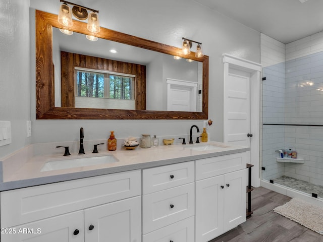 956 S Torrey Pines Dr, Williams, AZ 86046 - bathroom with double vanity, wood finished floors, and a tile shower