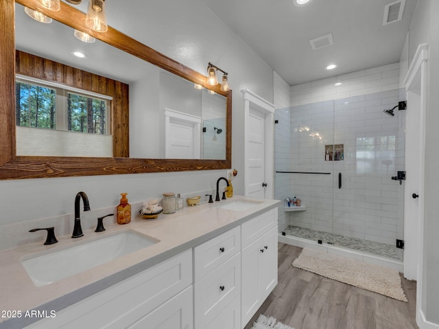 956 S Torrey Pines Dr, Williams, AZ 86046 - bathroom with double vanity, a stall shower, wood finished floors, and recessed lighting
