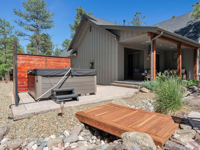 956 S Torrey Pines Dr, Williams, AZ 86046 - rear view of house featuring a hot tub, board and batten siding, a patio, and a shingled roof