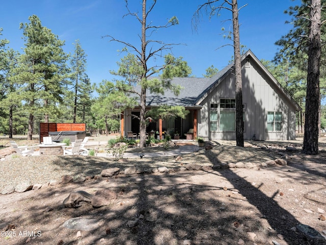 956 S Torrey Pines Dr, Williams, AZ 86046 - rear view of property with roof with shingles, a patio, and board and batten siding