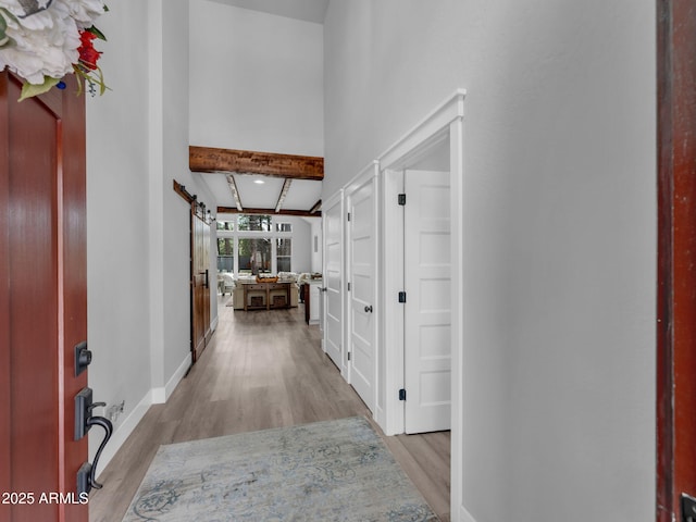 956 S Torrey Pines Dr, Williams, AZ 86046 - corridor featuring wood finished floors and a barn door