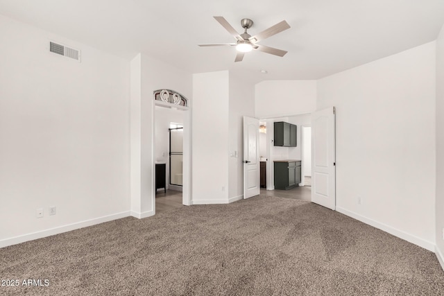 unfurnished bedroom featuring baseboards, carpet, visible vents, and connected bathroom