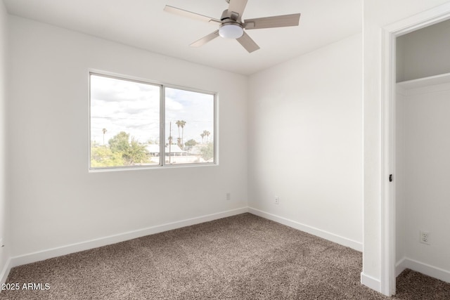 unfurnished bedroom featuring ceiling fan, baseboards, and carpet