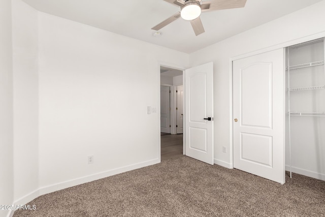 unfurnished bedroom with a closet, baseboards, ceiling fan, and carpet flooring