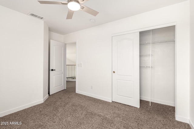 unfurnished bedroom with visible vents, baseboards, and carpet