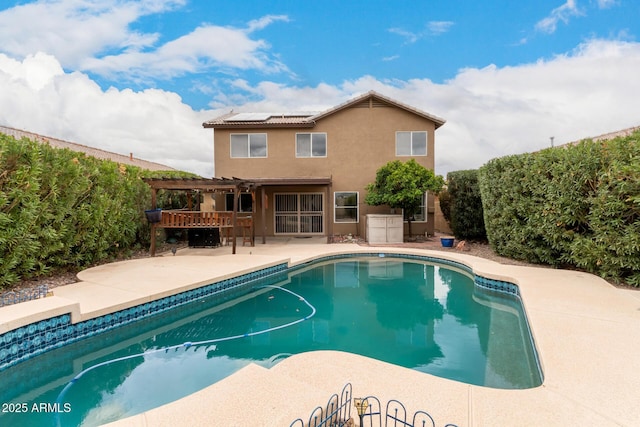 pool with a patio and a pergola