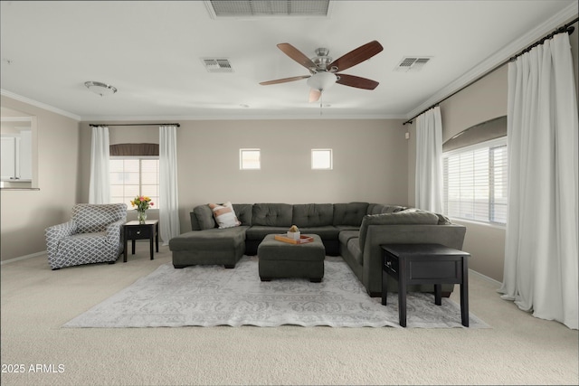 living room featuring light colored carpet, ceiling fan, and crown molding