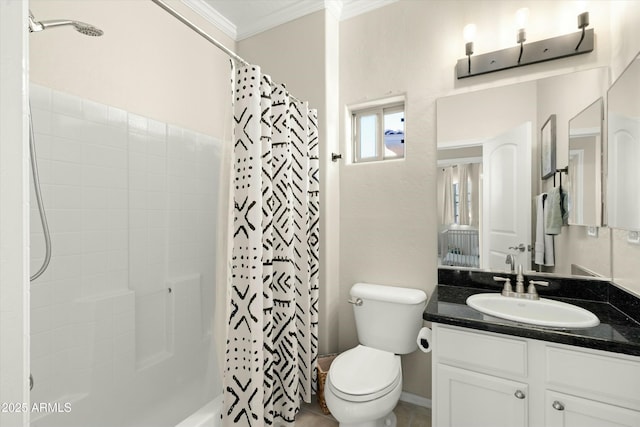 bathroom featuring toilet, ornamental molding, and vanity