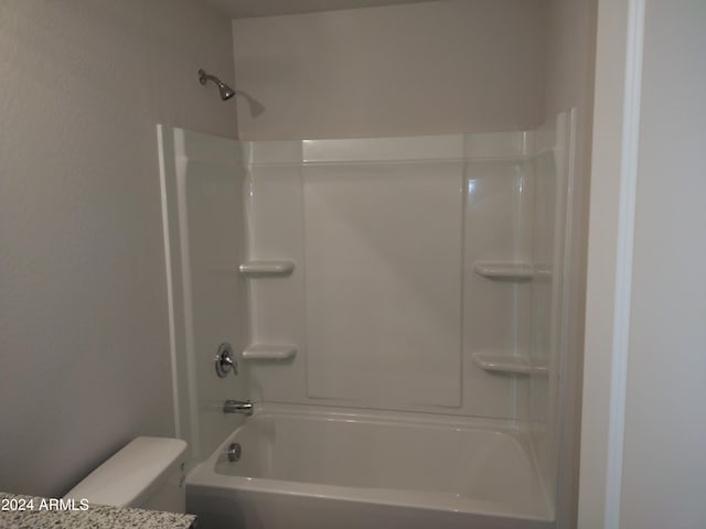 bathroom with toilet and shower / tub combination