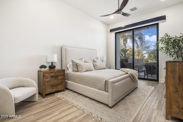 bedroom featuring ceiling fan, lofted ceiling, access to exterior, and light wood-type flooring