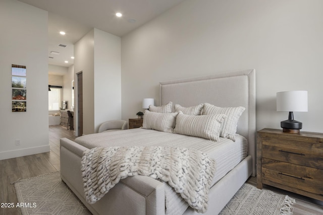 bedroom with light hardwood / wood-style floors