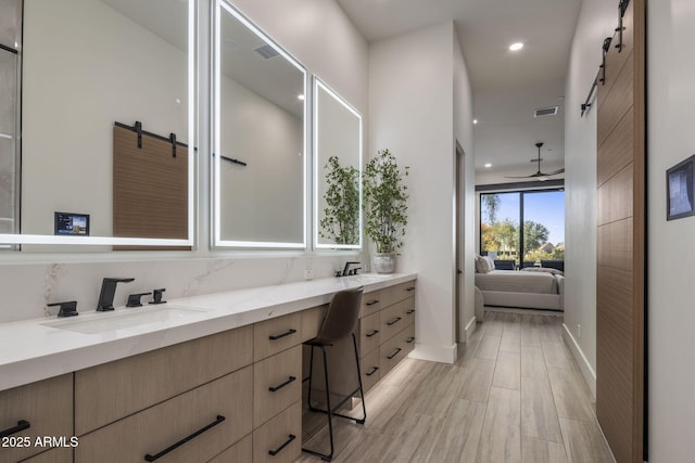 bathroom with vanity and hardwood / wood-style floors