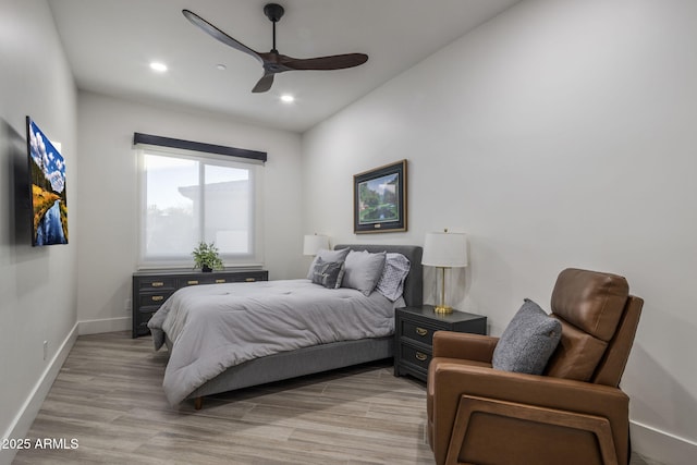 bedroom featuring ceiling fan and light hardwood / wood-style flooring