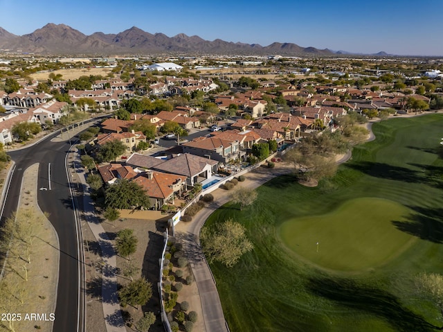 birds eye view of property with a mountain view