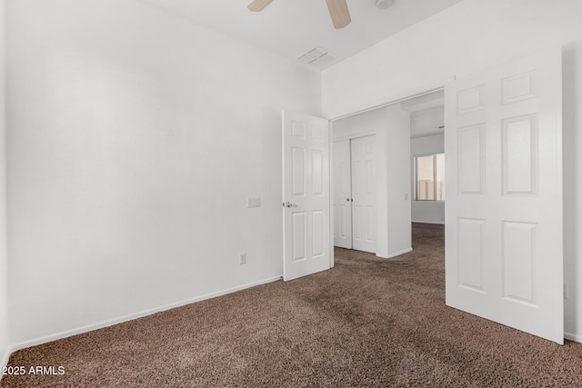 carpeted empty room featuring ceiling fan