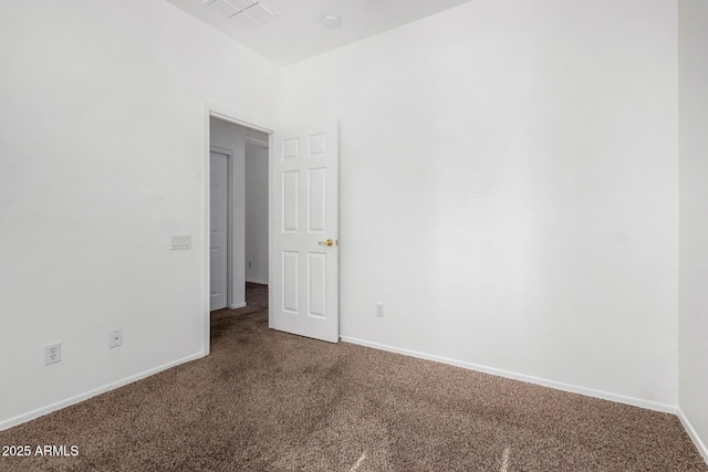 spare room featuring carpet floors