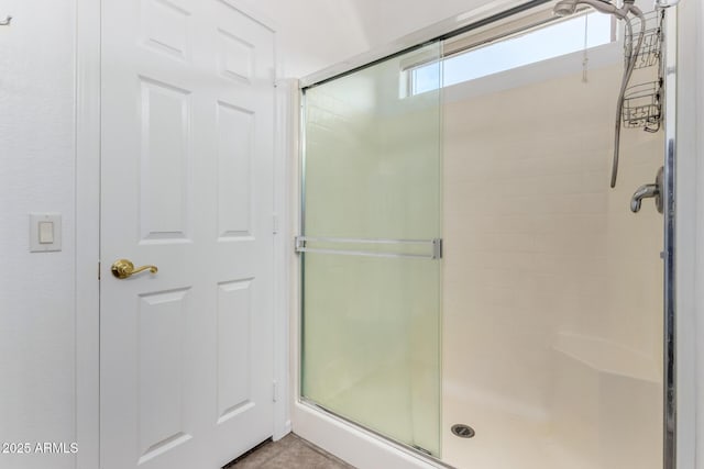 bathroom featuring an enclosed shower