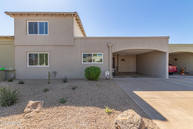 view of front of house featuring a carport