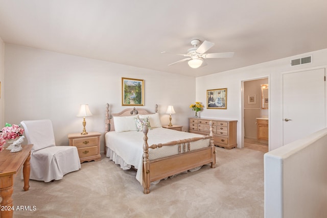 carpeted bedroom featuring ensuite bathroom and ceiling fan