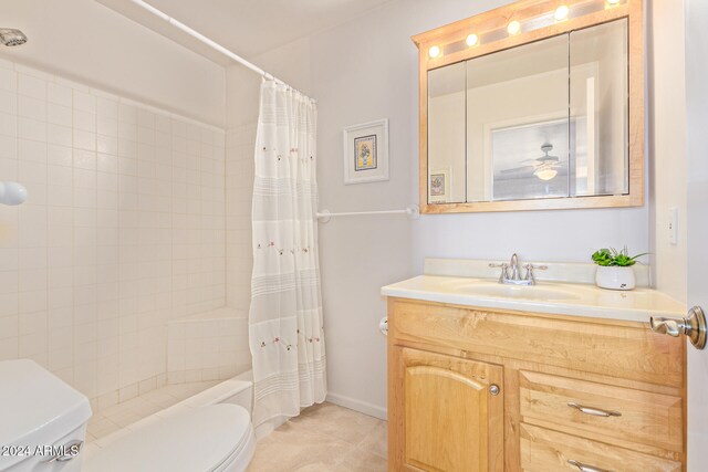 full bathroom featuring toilet, vanity, shower / bathtub combination with curtain, and ceiling fan