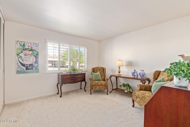 sitting room with light colored carpet