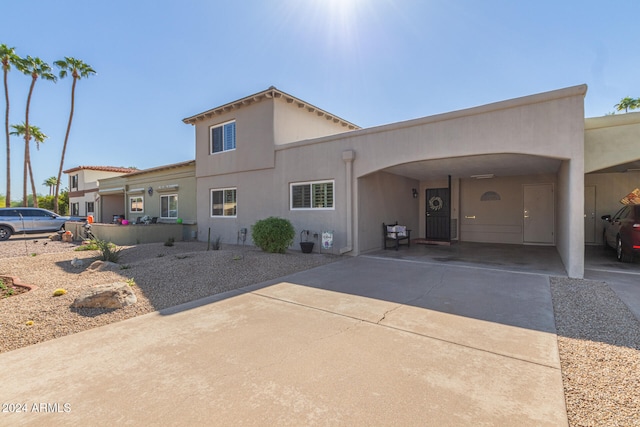 view of front facade with a carport