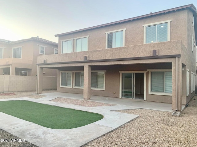 rear view of house featuring a patio