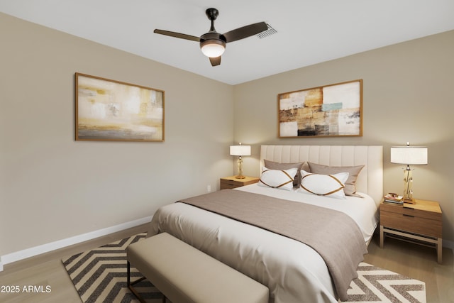 bedroom featuring ceiling fan and hardwood / wood-style flooring