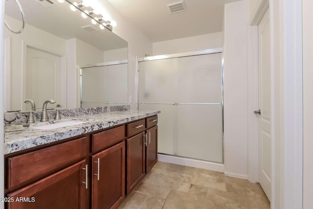 23162 W Lasso Ln, Buckeye, AZ 85326 - full bathroom featuring a shower stall and vanity