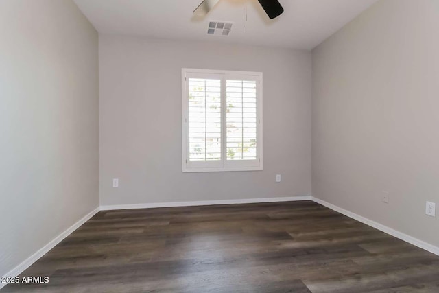 23162 W Lasso Ln, Buckeye, AZ 85326 - unfurnished room featuring ceiling fan, dark wood-type flooring, and baseboards