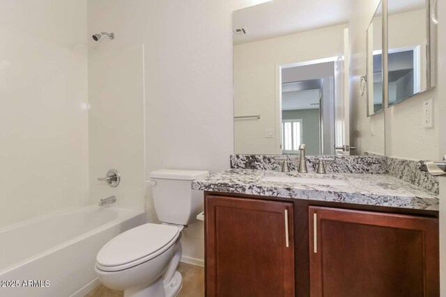 23162 W Lasso Ln, Buckeye, AZ 85326 - bathroom with toilet, vanity, and shower / washtub combination