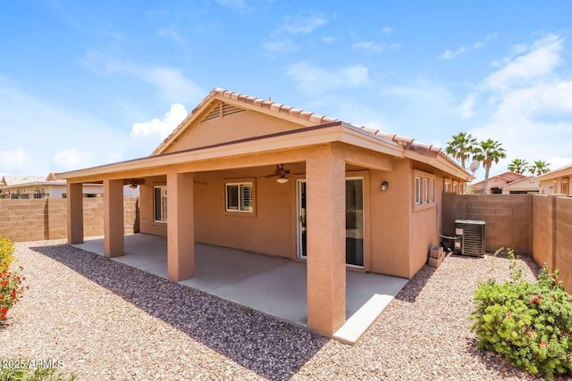23162 W Lasso Ln, Buckeye, AZ 85326 - back of property featuring stucco siding, ceiling fan, a fenced backyard, central AC unit, and a patio