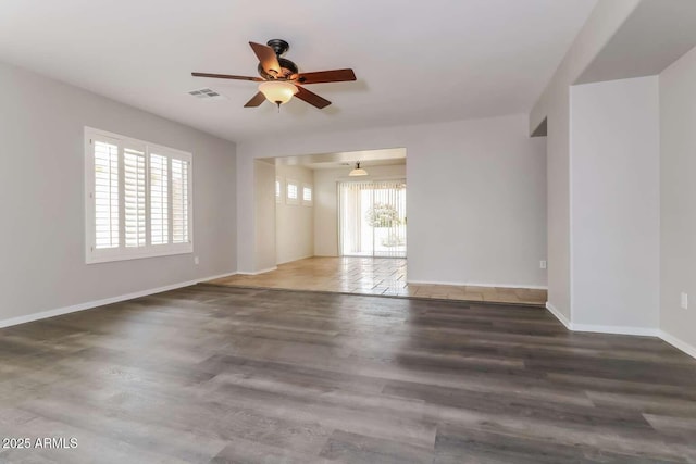 23162 W Lasso Ln, Buckeye, AZ 85326 - unfurnished room featuring a ceiling fan, baseboards, and wood finished floors