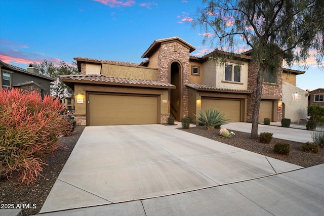 mediterranean / spanish-style house featuring a garage