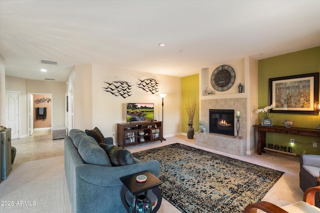 living room featuring a premium fireplace and light colored carpet