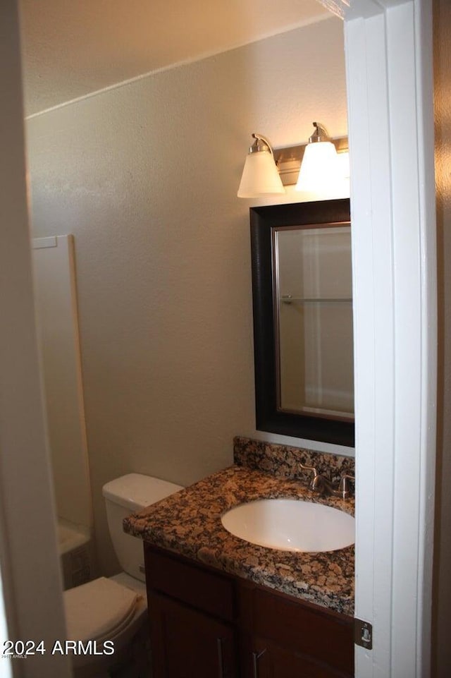 bathroom with vanity and toilet