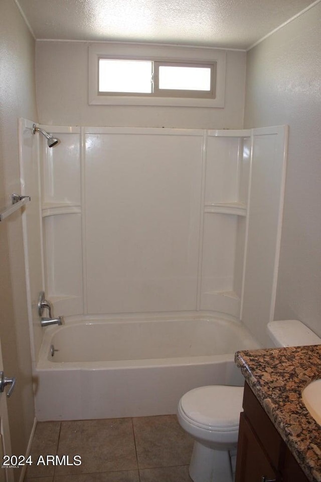 full bathroom with tile patterned floors, shower / tub combination, vanity, and toilet