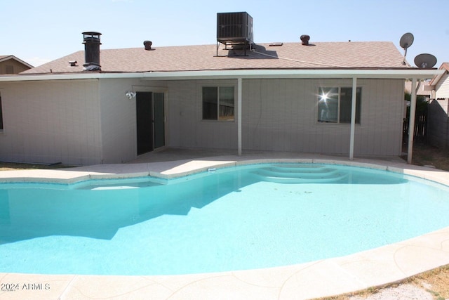 view of swimming pool featuring central AC and a patio area