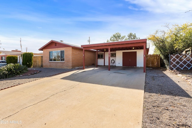 single story home featuring a carport