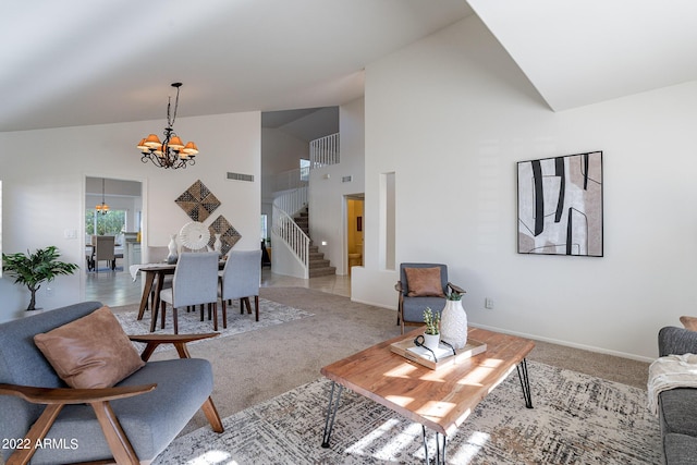 living room featuring visible vents, light carpet, high vaulted ceiling, stairway, and a chandelier