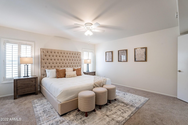 carpeted bedroom featuring ceiling fan and baseboards